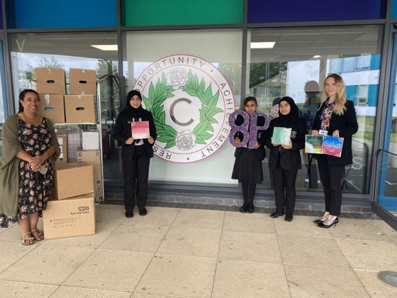 Class 8P presenting donations to Denise